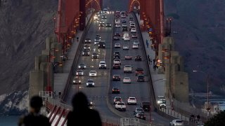 In this Nov. 12, 2020, file photo, traffic moves on the Golden Gate Bridge in San Francisco. The San Francisco Chronicle reported Saturday, May 15, 2021, that the iconic span started emanating a loud hum following a retrofit last year of the sidewalk safety railing on its western side. Crews replaced some 12,000 wide slats with narrower ones, to give the bridge a slimmer profile and make it safer in high winds.