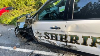 A damaged Snohomish County, Washington, sheriff's office vehicle after a Tesla allegedly on "Autopilot" struck it as it was parked on Saturday, May 15, 2021.