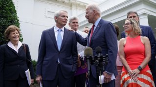 U.S. President Joe Biden speaks to Senator Rob Portman (R-OH), following a bipartisan meeting with U.S. senators about the proposed framework for the infrastructure bill, at the White House in Washington, U.S., June 24, 2021.