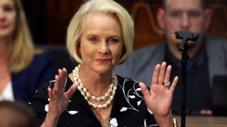 FILE - In this Jan. 13, 2020, file photo Cindy McCain, wife of former Arizona Sen. John McCain, waves to the crowd after being acknowledged by Arizona Republican Gov. Doug Ducey during his State of the State address on the opening day of the legislative session at the Capitol in Phoenix. Cindy McCain is going to bat for Joe Biden, lending her voice to a video set to air on Tuesday, Aug. 18, during the Democratic National Convention programming focused on Biden’s close friendship with her late husband, Sen. John McCain.