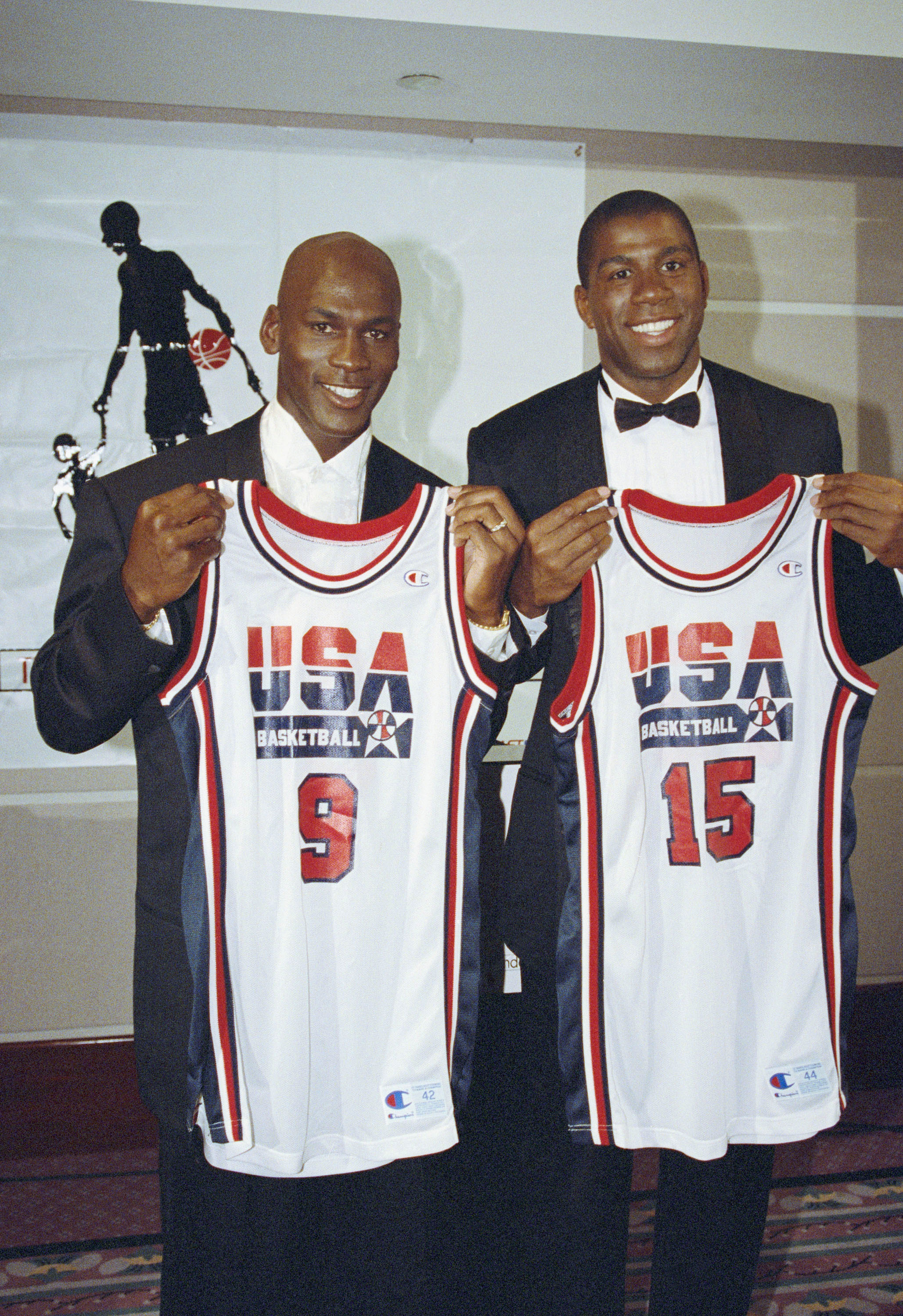 Michael Jordan, left, of the Chicago Bulls and Earvin "Magic" Johnson of the Los Angeles Lakers sport their new uniforms for the 1992 US Olympic Basketball team on Sept. 21, 1991, in Chicago, Illinois.