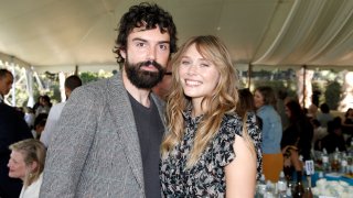BEVERLY HILLS, CALIFORNIA - OCTOBER 06: (L-R) Robbie Arnett and Elizabeth Olsen attend the Rape Foundation Annual Brunch 2019 at a Beverly Hills Private Estate on October 06, 2019 in Beverly Hills, California.