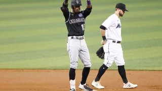 MIAMI, FLORIDA – JUNE 09: Raimel Tapia #15 of the Colorado Rockies celebrates after hitting a double during the first inning against the Miami Marlins at loanDepot park on June 09, 2021 in Miami, Florida. (Photo by Michael Reaves/Getty Images)