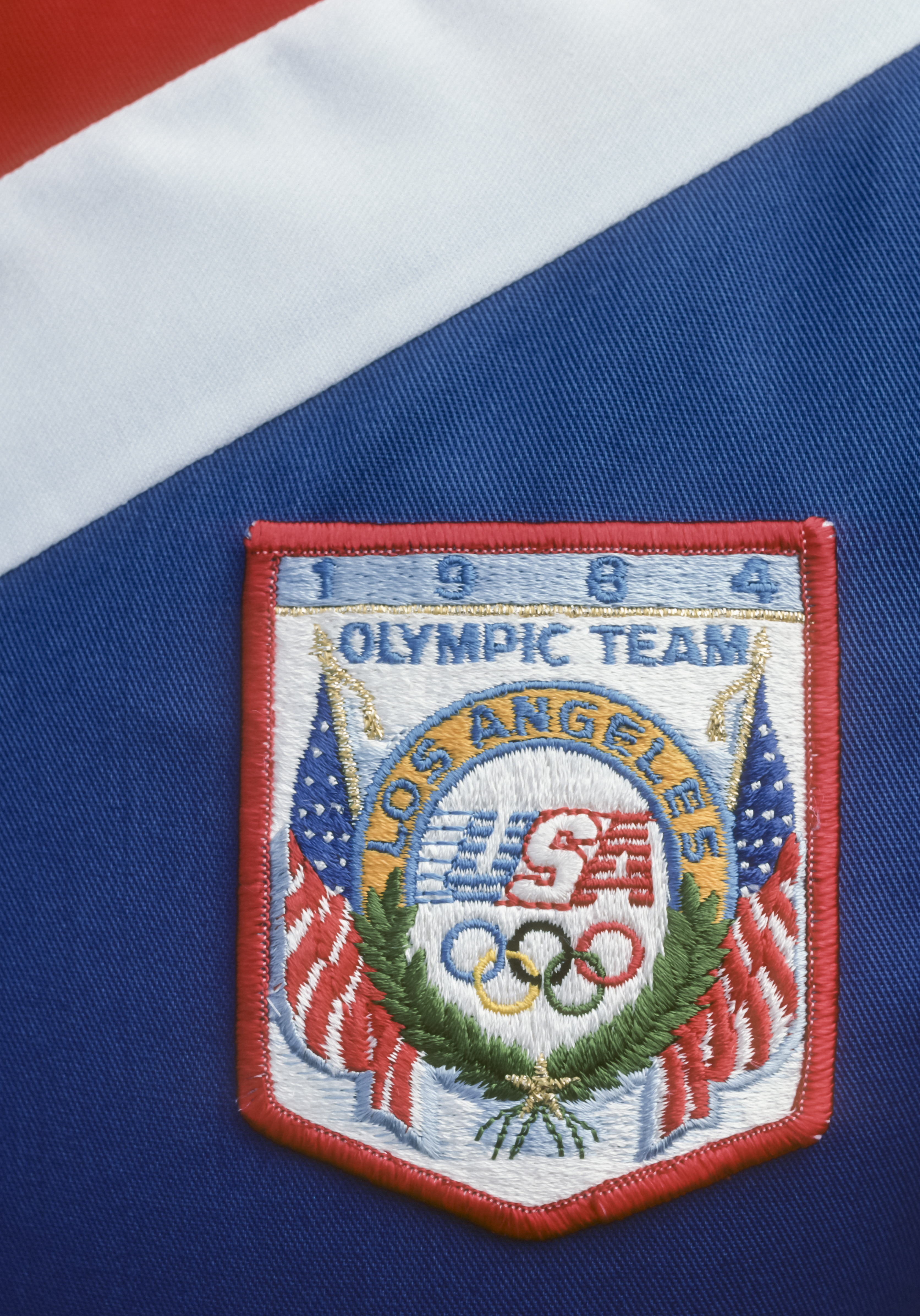 A closeup view of the emblem on the official uniform of the United States Olympic Team worn during the 1984 Summer Olympic Games in Los Angeles, California.