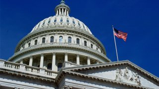 WASHINGTON, UNITED STATES - JANUARY 01: The stars and stripes flag flying at the Capitol Building, Washington, USA.