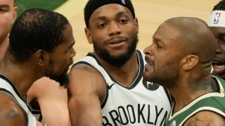 Brooklyn Nets' Bruce Brown tries to break up Kevin Durant and Milwaukee Bucks' P.J. Tucker during the second half of Game 3 of the NBA Eastern Conference basketball semifinals game Thursday, June 10, 2021, in Milwaukee.