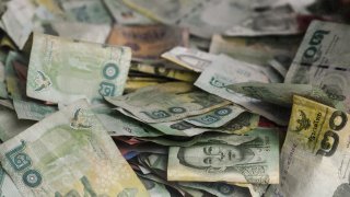 Thai Baht banknotes and coins.