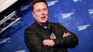 SpaceX owner and Tesla CEO Elon Musk poses as he arrives on the red carpet for the Axel Springer Awards ceremony, in Berlin, on December 1, 2020.