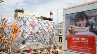 Covid-19 vaccines by Chinese firms Sinopharm (left) and Sinovac arrived at the Phnom Penh International Airport in Cambodia on June 8, 2021.