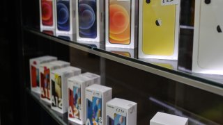 A store window in Dublin, Ireland, with iPhones and Samsung Galaxy handsets on display.