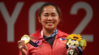 Philippines’ Hidilyn Diaz wins the gold medal in the women’s 55kg weightlifting competition during the Tokyo 2020 Olympic Games on July 26, 2021.