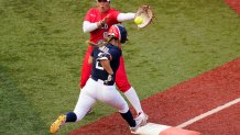 United States' Ali Aguilar (2) reaches first base for a single past Mexico's Victoria Vidales during the sixth inning a softball game at the 2020 Summer Olympics, Saturday, July 24, 2021, in Yokohama, Japan.