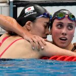 Yui Ohashi, of Japan, left, is embraced by Emma Weyant, of United States, after winning the final of the women's 400-meter Individual medley at the 2020 Summer Olympics, Sunday, July 25, 2021, in Tokyo, Japan.