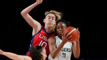 Nigeria's Adaora Elonu (11) drives past United States' Breanna Stewart (10) during women's basketball preliminary round game at the 2020 Olympics on July 27, 2021, in Saitama, Japan.
