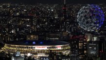 Drones fly to form an image of the Earth in the sky over the Olympic Stadium during the opening ceremony of the Tokyo 2020 Olympic Games, in Tokyo, on July 23, 2021.