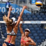 USA's Alix Klineman (L) blocks a shot by China's Xue Chen in their women's preliminary beach volleyball pool B match between the USA and China during the Tokyo 2020 Olympic Games at Shiokaze Park in Tokyo on July 25, 2021.