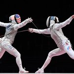 USA's Lee Kiefer, left, compete against Russia's Inna Deriglazova in the women's foil individual gold medal bout during the Tokyo 2020 Olympic Games at the Makuhari Messe Hall in Chiba City, Chiba Prefecture, Japan, on July 25, 2021.