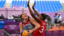USA's Stefanie Dolson (l) fights for the ball with Japan's Stephanie Mawuli during the women's first round 3x3 basketball match between USA and Japan at the Aomi Urban Sports Park in Tokyo, on July 27, 2021 during the Tokyo 2020 Olympic Games. (Photo by Ina FASSBENDER / AFP) (Photo by INA FASSBENDER/AFP via Getty Images)