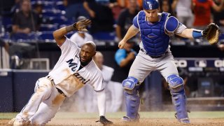 MIAMI, FLORIDA – JULY 06: Starling Marte #6 of the Miami Marlins slides home safely to score the winning run on a passed ball and error by Will Smith #16 of the Los Angeles Dodgers during the tenth inning at loanDepot park on July 06, 2021 in Miami, Florida. (Photo by Michael Reaves/Getty Images)