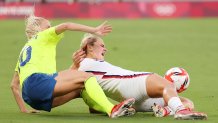 Lindsey Horan #9 of Team United States is challenged by Sofia Jakobsson #10 of Team Sweden during the Women's First Round Group G match between Sweden and United States during the Tokyo 2020 Olympic Games at Tokyo Stadium on July 21, 2021 in Chofu, Tokyo, Japan.