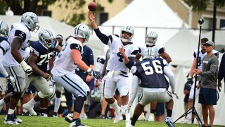 FILE: Dallas Cowboys QB Dak Prescott (4) passing during preseason training camp at River Ridge Playing Fields in Oxnard, California on July 28, 2018.