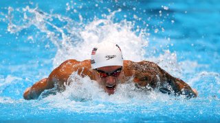 Caeleb Dressel went 50.39 in his 100m butterfly heat to tie the Olympic record.