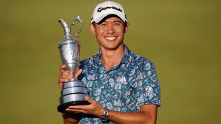 Jul 18, 2021; Sandwich, England, GBR; Collin Morikawa celebrates with the Claret Jug on the 18th green following his final round winning the Open Championship golf tournament.