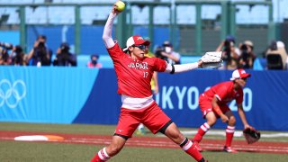 Pitcher Yukiko Ueno of Japan winds up for a pitch in the first inning during the Tokyo 2020 Olympic Games against Australia at Fukushima Azuma Baseball Stadium.