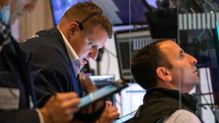 Traders work on the floor of the New York Stock Exchange (NYSE) in New York, on Monday, Aug. 23, 2021.