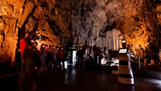 Persephone guides the visitors inside Alistrati cave