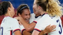United States' Lynn Williams, center, celebrates with teammates after scoring a goal against Netherlands during a women's quarterfinal soccer match at the 2020 Summer Olympics