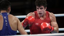 USA's Richard Torrez Jr (red) and Kazakhstan's Kamshybek Kunkabayev compete during their men's super heavy (over 91kg) semi-final boxing match during the Tokyo 2020 Olympic Games