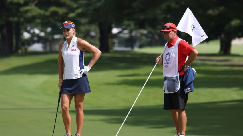 KAWAGOE, JAPAN – AUGUST 04: Lexi Thompson of Team United States and caddie Jack Fulghum stand on the third green during the first round of the Women’s Individual Stroke Play on day twelve of the Tokyo 2020 Olympic Games at Kasumigaseki Country Club on August 04, 2021 in Kawagoe, Japan. (Photo by Chris Trotman/Getty Images)