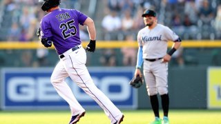DENVER, COLORADO – AUGUST 06: C.J. Cron #25 of the Colorado Rockies circles the bases after hitting a solo home run against the Miami Marlins in the second inning at Coors Field on August 06, 2021 in Denver, Colorado. (Photo by Matthew Stockman/Getty Images)
