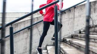 Woman running up the stairs