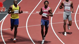 USA's Noah Lyles reacts after winning ahead of second-placed Sibusiso Matsenjwa and Canada's Brendon Rodney in the men's 200m heats during the Tokyo 2020 Olympic Games