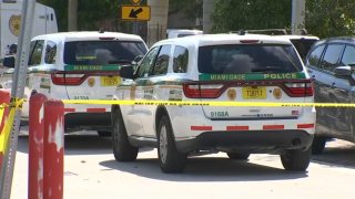 Officers respond after a man is fatally shot inside a car in southwest Miami-Dade on Sept. 8, 2021.