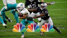 LAS VEGAS, NEVADA - DECEMBER 26: Myles Gaskin #37 of the Miami Dolphins is brought down by Lamarcus Joyner #29 of the Las Vegas Raiders during the fourth quarter of a game at Allegiant Stadium on December 26, 2020 in Las Vegas, Nevada. (Photo by Harry How/Getty Images)