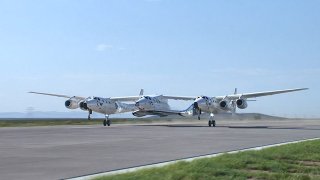 Carrier aircraft VMS Eve takes off from Spaceport America in New Mexico, carrying spacecraft VSS Unity on July 11, 2021.
