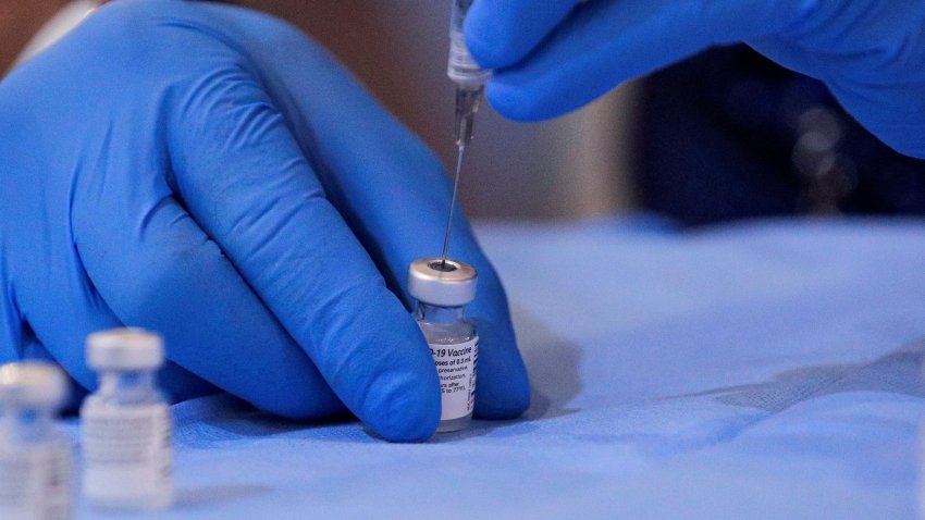 A syringe is filled with a dose of Pfizer’s coronavirus disease (COVID-19) vaccine at a pop-up community vaccination center at the Gateway World Christian Center in Valley Stream, New York, U.S., February 23, 2021.