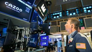 A trader works on the floor at the New York Stock Exchange, August 27, 2021.