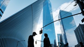 People walk near the sight of Ground Zero and the Freedom Tower on the day that the United States officially ended its participation in the war in Afghanistan on August 30, 2021 in New York City.