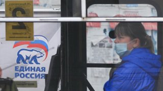 A bus drives past a United Russia campaign poster put up ahead of the elections to the Russian State Duma of the 8th convocation scheduled for September 17-19.