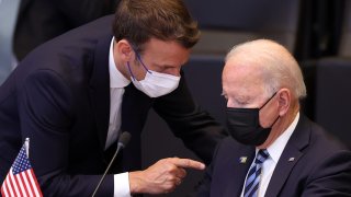 U.S. President Joe Biden (R) and French President Emmanuel Macron (L) have a conversation ahead of the NATO summit at the North Atlantic Treaty Organization (NATO) headquarters in Brussels, on June 14, 2021.