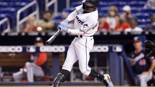 MIAMI, FLORIDA – SEPTEMBER 20: Jazz Chisholm Jr. #2 of the Miami Marlins hits a solo home run off Erick Fedde #23 of the Washington Nationals (not pictured) during the third inning at loanDepot park on September 20, 2021 in Miami, Florida. (Photo by Michael Reaves/Getty Images)