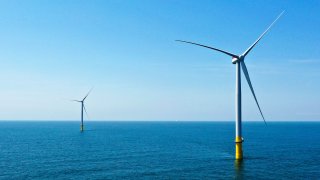 Two offshore wind turbines constructed off the coast of Virginia Beach, Virginia, June 29, 2020.