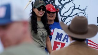 In this Saturday, Sept. 25, 2021, photo Republican congressional candidate Mayra Flores, left, attends a March to the Border event in McAllen, Texas