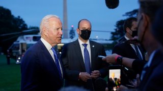 President Joe Biden talks with reporters after returning to the White House in Washington, Tuesday, Oct. 5, 2021, after a trip to Michigan to promote his infrastructure plan.