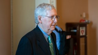 Senate Minority Leader Mitch McConnell of Ky., walks back to his office on Capitol Hill, Thursday, Oct. 7, 2021, in Washington.