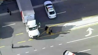 Police are investigating after a woman was struck and killed by a tractor-trailer in Miami.